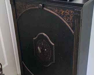 Black cabinet with Gold accents