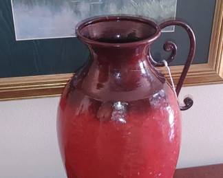 Large red metal vase