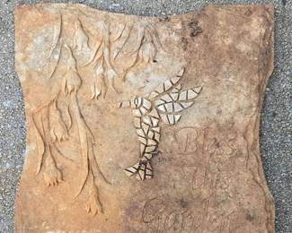 mold-cast concrete garden stepping stone featuring a mosaic-style hummingbird and the embossed text "Bless This Garden," 
