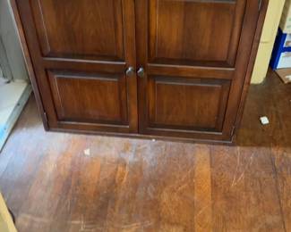 Two-Door Wooden Storage Cabinet with Raised Panel Accents