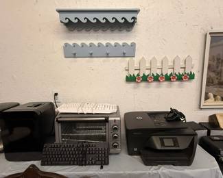 desktop fridge, toaster oven, keyboards, HP printer, shelves and coat rack
