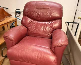 Leather recliner.  There is a wooden riser attached to the base to make chair higher and an extension on the reclining lever for easier use