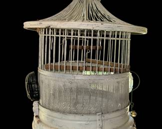 an antique, white-painted metal birdcage featuring a domed or pagoda-style roof, likely from the Art Deco era of the 1920s or 1930s, resembling designs by makers like Hendryx