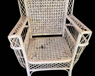 Antique wicker chair with magazine holders