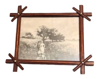 Vintage Black Forest Adirondack picture frame with sepia print of a pastoral scene