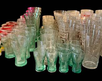 A collection of Coca-Cola glasses and other things Coca-Cola