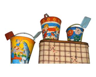 a collection of vintage tin lithographed sand pails