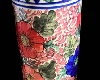 vintage hand-painted ceramic umbrella stand decorated with vibrant red and pink floral motifs and blue geometric borders