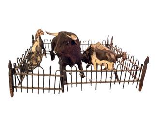Toy antique wrought iron fence with miniature, taxidermy bulls and horses