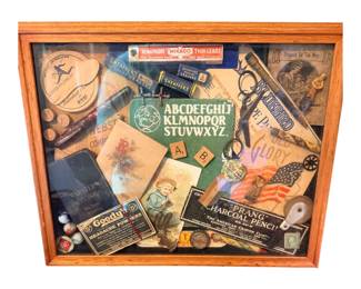 Shadowbox collage of antique advertising items and toys