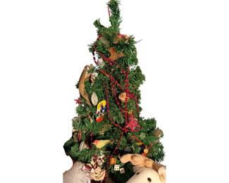 Small Christmas tree adorned with vintage items