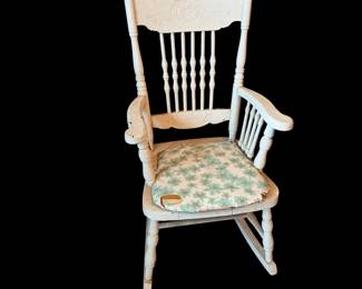 Antique child’s press back rocker