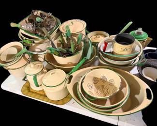 Lots of green and cream enamelware in vintage green wooden kitchen handled utensils