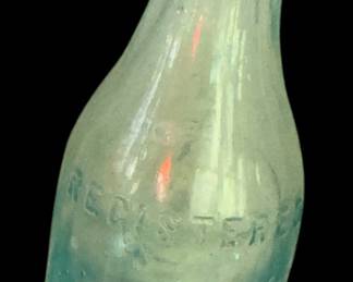 Rye-Ola was produced roughly between 1905 and 1922. Based on the heavy glass, straight-sided shoulder structure, and embossed circular slug plate, this specific Vienna, Georgia variant likely dates to around 1905–1915