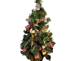 Small Christmas tree adorned with vintage items