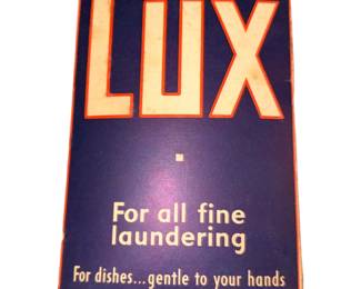 vintage Lux soap flakes box from the mid-20th century, featuring a dark blue and red package design marked "For all fine laundering" and "For dishes... gentle to your hands