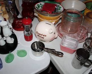Pink depression glass jar, candy dish with lid, and small glass pitcher / "Chocolate Money" pink piggy bank, red glass hen on a nest