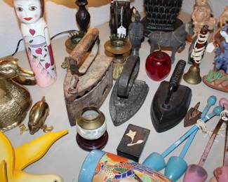 Collection of antique "sad irons" used for fabric ironing before modern electric irons, used for decorative home items or doorstops