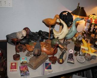 Various antique hand-carved wooden duck decoys and shorebirds