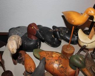 Various antique hand-carved wooden duck decoys and shorebirds