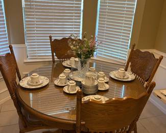 Beaty of a kitchen table complete with 4 chairs in incredible condition
