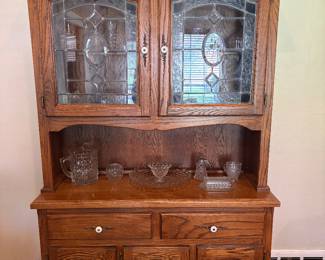 Beautiful Oak hutch with leaded glass upper cabinet doors.