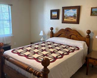 Super sturdy queen size bed with mattress and gorgeous quilt on top