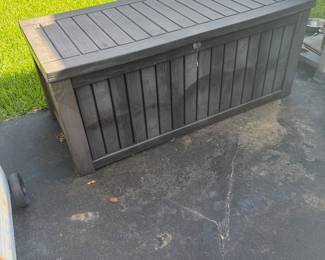 Outdoor plastic insulated storage bin in brown