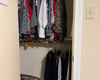 More name brand ladies clothing and a vintage Samsonite suitcase