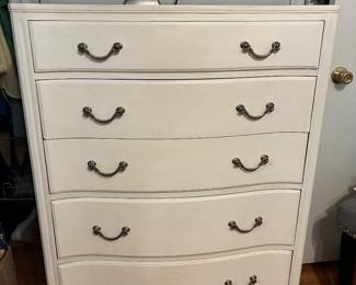 Dresser has matching nightstands and a longer dresser with mirror 