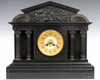 A 19th century French mantel clock by Japy Freres, Paris.  8-day time and strike movement with Gilded dial with porcelain center and Arabic numerals, serial #85766.  Black marble Neoclassical style case with a pediment top over a cast Bronze frieze depicting Neptune with gilded detail, arcaded  body with two pairs of cast Corinthian columns on a molded plinth base.  Minor wear, some tiny edge flakes, running when cataloged.  16 1/4" high.  ESTIMATE $400-600