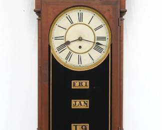 A late 19th century Waterbury Peoria model wall clock.  8-day time and strike movement with painted metal dial and Roman numerals, lower calendar mechanism with apertures indicating day, month and date.  Walnut case with carved detail features a shaped crest with turned finials over a single door with reverse painted glass flanked by turned pilasters above a shaped lower drop.  Interior and verso labels 50% intact.  Older refinishing with some wear, running when cataloged.  42 1/2" high.  ESTIMATE $800-1,200