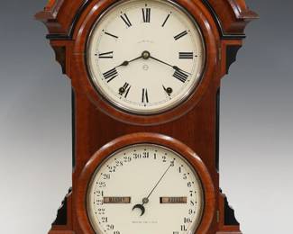 A late 19th century Seth Thomas Parlor Calendar No. 4 model shelf clock.  8-day time and strike movement with lower calendar mechanism, painted metal dials with Roman/Arabic numerals and apertures indicating day and month.  Walnut case with Ebonized detail features an arched top and molded detail over a single door with circular dial glasses on a stepped, molded base.  Paper label on back of door 50% intact.  Nicely refinished with slight wear, restored dials, running when cataloged.  24 1/2" high overall.  ESTIMATE $400-600
