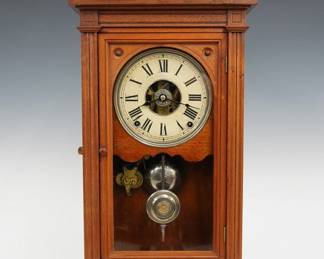 A late 19th century Seth Thomas Greek VP model City Series shelf clock.  8-day spring driven time, strike and alarm movement with painted metal dial and Roman numerals.  Walnut case with a scrolled crest and urn finial above single arched door and a molded base.  Refinished with slight wear, replaced finial, running when cataloged.  24 1/4" high.  ESTIMATE $100-150