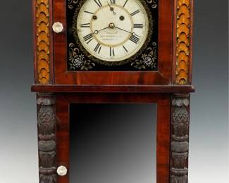A 19th century Asa Munger shelf clock. 8-day weight driven time and strike movement marked No. 406, painted iron dial with Roman numerals, subsidiary seconds and "Flying Eagle" pendulum bob, dial marked "Warranted by Asa Munger & Co. Auburn N-Y.". Mahogany case with carved cornucopia crown above an upper dial door with reverse painted glass flanked by inset reverse painted panels above a lower mirrored door flanked by carved pilasters above a base with carved paw feet, some original wallpaper on interior of backboard with paper label 50% intact. Older refinishing with some wear, re-painted dial glass, some loss to lower mirror silvering, replaced pulleys, weights and pendulum bob, running when cataloged. 39 1/4" high overall. ESTIMATE $600-800