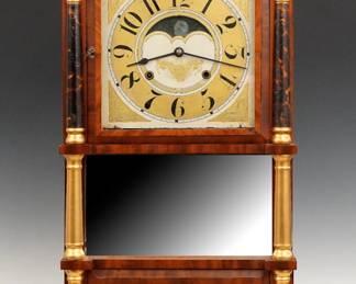 A mid 19th century Birge & Mallory Triple Decker shelf clock.  8-day strap Brass time and strike movement, painted wooden dial with Arabic numerals and floral detail.  Mahogany case with a gesso Eagle crown over an upper door with clear dial glass, center mirror, flanked by turned columns, above a lower door with reverse painted glass flanked by turned pilasters over turned feet.  Interior paper label 20% intact.  Refinished with minor wear, restoration to crown, paint restored, running when cataloged.  37 3/4" high.  ESTIMATE $200-300