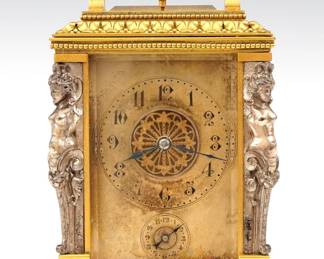 A late 19th century French Carriage clock. 8-day time and strike movement with platform escapement, gong strike and repeat on demand button, Silvered dial with foliate center marked L & E Fabre, Buenos Aires, and Roman numerals. Gilded Brass case with upper swing handle, cast foliate design, Silvered caryatid pilasters, beveled glass front, back and sides, on a molded base. Minor wear, dial tarnish, running when cataloged. 6" high overall. ESTIMATE $800-1,200
