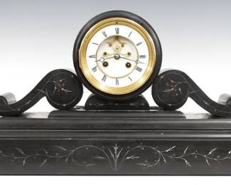 A 19th century French mantel clock by Samuel Marti, Paris.  8-day time and strike movement with visible escapement and two piece White porcelain dial with Roman numerals, serial #5401.  Black marble Empire style case with a  rounded top over a body with scrolled brackets on a molded plinth base with incised detail.  Minor wear, some small edge chips, lacks pendulum not tested.  12 1/4" high.  ESTIMATE $300-500