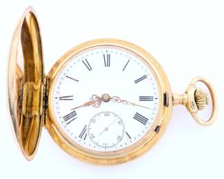 A late 19th century 14k Gold Swiss pocket watch.  52mm, 15j, SW, LS, bridge movement under a 14k cuvette, Fancy engraved 14k Gold HC, porcelain SSD with Roman numerals and fancy Gold hands.  85.9 grams total weight.  Some case wear, dent in rear cover, winds, sets and running when cataloged.  ESTIMATE $2,000-3,000