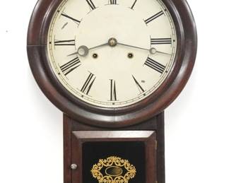 A late 19th century Atkins Clock Company wall clock.  8-day spring driven time and strike movement with painted metal dial and Roman numerals.  Rosewood case with molded dial door over a short drop with door and reverse painted glass.  Restored finish with some wear, veneer loss to one side return, minor dial wear, running when cataloged.  24 1/2" high.  ESTIMATE $200-300
