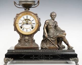 A late 19th century New Haven Brennus model figural mantel clock.  8-day time and strike movement with visible escapement and two part porcelain dial with Roman numerals, fancy filigree hands.  Black enameled iron base with cast Spelter figure, case and feet.  Original finish with some wear, running when cataloged.  15 3/4" high overall.  ESTIMATE $300-400