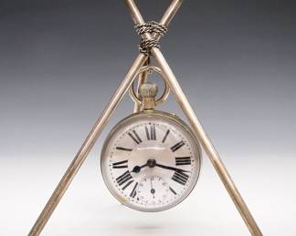 An early 20th century Atlas Crystal Ball novelty clock on a Silver plated tripod stand. 15j Swiss stem wind, pin set bridge movement with porcelain dial and Roman numerals. Minor wear, running when cataloged. 6" high overall. ESTIMATE $200-300