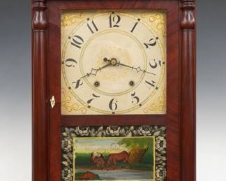 An early 19th century Riley Whiting Column & Splat shelf clock. 30-hr wooden plate time and strike movement, painted wooden dial with Arabic numerals and scrollwork detail. Mahogany case with a shaped crest over a single door with clear dial glass and reverse painted lower, flanked by turned pilasters all supported by carved paw feet. Interior paper label 60% intact. Refinished with minor wear, restored crest, running when cataloged. 27 1/2" high. ESTIMATE $200-300