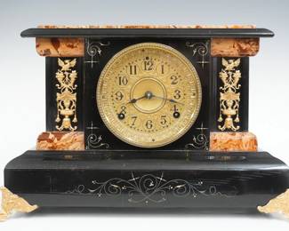 A turn of the century Seth Thomas No. 763 model Adamantine mantel clock.  8-day time and strike movement with papered metal dial, Arabic numerals, embossed dial and bezel.  Black Adamantine finish with marbleized detail, gold metal castings.  Case cleaned and polished with slight wear, castings re-painted, running when cataloged.  11" high.  ESTIMATE $150-200