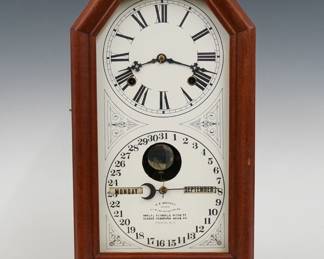 A late 19th century Ithaca No. 11 Octagon Poni Model shelf clock.  8-day time and strike movement with lower calendar mechanism and apertures indicating day and month, papered metal dial with Roman/Arabic numerals.  Mahogany case with a single door and molded octagon top with single long glass on a molded base. Paper instruction label on back 60% intact.   Refinished with slight wear, re-papered dial, running when cataloged.  17 3/4" high.  ESTIMATE $100-200