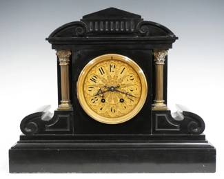 A 19th century French mantel clock by Japy Freres, Paris.  8-day time and strike movement with Gilded dial, Bronze sash and Arabic numerals, serial #4800.  Black marble Neoclassical style case with a shaped top over a body with Brass Corinthian columns on a molded plinth base.  Minor wear, some small edge chips, running when cataloged.  16 1/4" high.  ESTIMATE $300-500