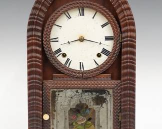 A 19th century J. C. Brown ripple front shelf clock. 8-day Brass time and strike movement with papered metal dial. Rosewood Round Gothic or "Beehive" style case with applied ripple molding, single door with circular upper glass and reverse painted lower. Paper label inside back 50% intact. Old finish with wear, flaking to lower glass, dial discoloration, running when cataloged. 18 3/4" high. ESTIMATE $300-500