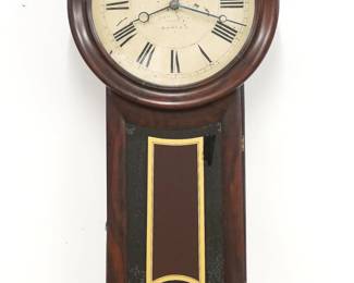 A late 19th century Howard No. 11 model "Keyhole" wall clock.  8-day weight driven time only movement with a painted metal dial and Roman numerals marked "E. Howard & Co. Boston".   Rosewood case features a circular dial door with molded frame over a lower door with rounded bottom and reverse painted glass.  Annotated inside "Portland Freight Terminal".  Older refinishing with minor wear, dial wear, some paint flaking on lower glass, replaced weight baffle, running when cataloged.  31 1/2" high.  ESTIMATE $1,000-1,500