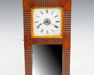 An early 20th century Darche Electric Co. boudoir clock. 30-hour spring driven mechanical movement with painted metal dial and Roman numerals, battery powered alarm bell at interior. Oak case with molded geometric design features a molded top over a single long door with clear dial glass and lower beveled mirror. Paper instruction card at inner door. Old finish with minor wear, lacks battery, loss to mirror silvering, wound tight, not running when cataloged. 17 1/4" high. ESTIMATE $400-600