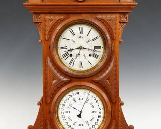 A late 19th century Welch, Spring & Co. Audran Model shelf clock.  8-day time and strike movement with upper day of the week and B. B. Lewis lower calendar mechanism indicating date and month, papered metal dials with Roman/Arabic numerals.  Walnut case with carved detail features an shaped crest above two doors with circular dial glasses flanked by carved ears and panels on a molded base.  Interior paper label 80% intact, but very dark.  Refinished with minor wear, some dial wear, running when cataloged.  31 1/2" high.  ESTIMATE $600-800